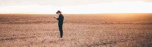 Man Praying in Field